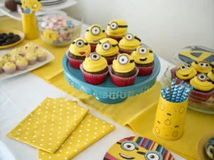 Festive table setting with minion cupcakes.