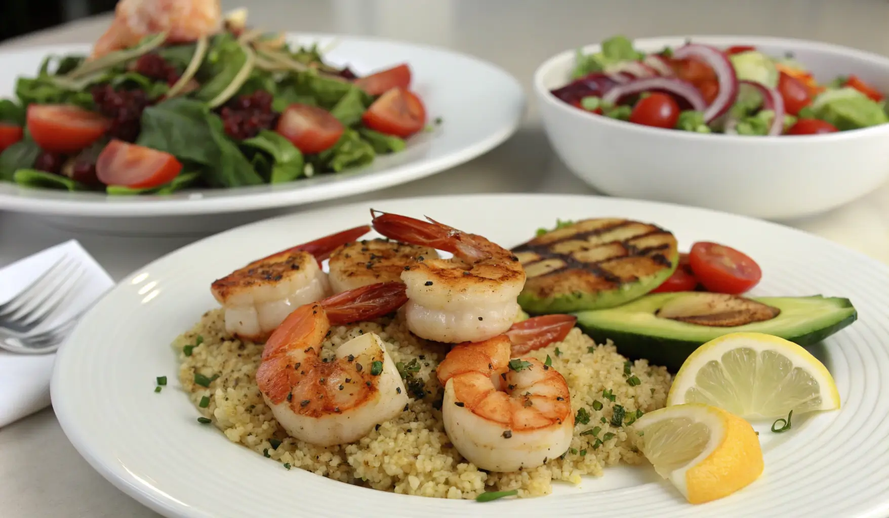 Different serving suggestions for shrimp and scallop dishes displayed on a table.